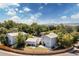 Suburban home with mature trees and landscaping, showing a spacious backyard and fencing at 6502 W 96Th Ave, Westminster, CO 80021