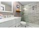 Beautiful bathroom featuring a shower with glass doors and a marble-look vanity with modern fixtures at 6502 W 96Th Ave, Westminster, CO 80021