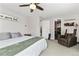 Cozy bedroom with a bed, a chair, a closet, and calming decor at 6502 W 96Th Ave, Westminster, CO 80021