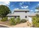 Two-story home with light gray siding, well-maintained landscaping, and an attached garage at 6502 W 96Th Ave, Westminster, CO 80021