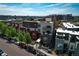 Stunning aerial view of modern townhomes showcasing rooftops, street view, and surrounding city landscape at 2650 W Front View Crescent Dr # 101, Denver, CO 80211