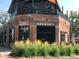 Charming brick brewery with outdoor seating, large windows, and decorative grasses at 2650 W Front View Crescent Dr # 101, Denver, CO 80211