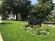 Beautifully maintained Jefferson Park with lush green grass, mature trees, and colorful flowerbeds at 2650 W Front View Crescent Dr # 101, Denver, CO 80211