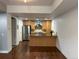 Stylish kitchen with wood floors, an island, and stainless steel appliances at 2650 W Front View Crescent Dr # 101, Denver, CO 80211