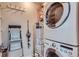 Convenient laundry area features a stacked washer and dryer at 2650 W Front View Crescent Dr # 101, Denver, CO 80211