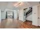 Inviting living area featuring hardwood floors, contemporary design, and staircase to the upper level at 2650 W Front View Crescent Dr # 101, Denver, CO 80211