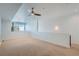 Loft area with ceiling fan, carpeted floor and a well lit sitting area at 2650 W Front View Crescent Dr # 101, Denver, CO 80211