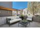 Inviting patio with modern outdoor furniture, perfect for relaxing and enjoying the outdoors at 2650 W Front View Crescent Dr # 101, Denver, CO 80211