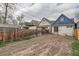 Large, fenced backyard ready for landscaping or recreation, offering privacy and outdoor space at 160 W Bayaud Ave, Denver, CO 80223