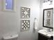 Well-lit bathroom with modern fixtures, stylish mirror, and clean design offering a comfortable and functional space at 160 W Bayaud Ave, Denver, CO 80223