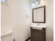 Bathroom featuring a modern vanity, sink, and toilet at 160 W Bayaud Ave, Denver, CO 80223