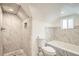 Bright bathroom featuring a marble tile walk-in shower and built in soaking tub at 160 W Bayaud Ave, Denver, CO 80223