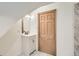 Bathroom with a vanity and a wooden door with a beveled frame at 160 W Bayaud Ave, Denver, CO 80223