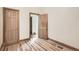 Bedroom boasts wood floors, decorative trim, and two doors at 160 W Bayaud Ave, Denver, CO 80223