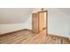Bedroom has hardwood floors and a door leading to a staircase at 160 W Bayaud Ave, Denver, CO 80223