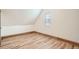 Bedroom features wood laminate flooring, neutral paint and natural light from a window at 160 W Bayaud Ave, Denver, CO 80223