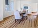 Close up of the dining room with hardwood floors, and a view of the kitchen at 160 W Bayaud Ave, Denver, CO 80223