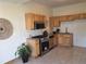 Bright kitchen featuring stainless steel appliances, granite countertops, and natural wood cabinetry at 160 W Bayaud Ave, Denver, CO 80223
