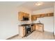 Modern kitchen with stainless steel appliances, granite countertops, and wooden cabinets providing a functional cooking area at 160 W Bayaud Ave, Denver, CO 80223