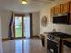 Kitchen featuring granite countertops, stainless steel appliances, and patio doors leading to the backyard at 160 W Bayaud Ave, Denver, CO 80223
