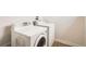 Laundry room featuring a white washer and dryer at 160 W Bayaud Ave, Denver, CO 80223