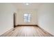 Bright living room with hardwood floors and a view from the window at 160 W Bayaud Ave, Denver, CO 80223