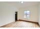 Bright living room with hardwood floors, a large window, and neutral walls offers a modern and inviting space at 160 W Bayaud Ave, Denver, CO 80223