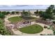 Spacious dog park with separate fenced areas for large and small dogs, featuring shaded seating at 17112 W 91St Ln, Arvada, CO 80007