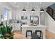 Spacious kitchen featuring white cabinets, stainless steel appliances, and an island with seating at 17112 W 91St Ln, Arvada, CO 80007