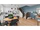 Bright kitchen and dining area with an island and stainless steel appliances at 17112 W 91St Ln, Arvada, CO 80007