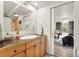 Bathroom with wood cabinets and a large mirror at 197 Sawmill Ln, Idaho Springs, CO 80452