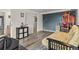 Bedroom features gray laminate flooring, a futon and a large canvas painting at 197 Sawmill Ln, Idaho Springs, CO 80452