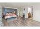 Spacious bedroom features modern flooring, an accent wall, and an ensuite bathroom for convenience at 197 Sawmill Ln, Idaho Springs, CO 80452
