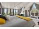 Bright bedroom with vaulted ceiling, large windows offering scenic views, and access to a private balcony at 197 Sawmill Ln, Idaho Springs, CO 80452