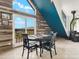 Charming dining area featuring a round table, decorative antler centerpiece, and access to the outdoors at 197 Sawmill Ln, Idaho Springs, CO 80452