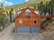 Stunning mountain home with two-car garage, private balcony, and scenic views of surrounding forest at 197 Sawmill Ln, Idaho Springs, CO 80452