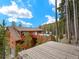Stunning exterior showcasing a multi-level deck with scenic mountain and forest views at 197 Sawmill Ln, Idaho Springs, CO 80452