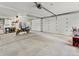 Spacious two car garage with motorcycle, storage shelves, and ample space at 197 Sawmill Ln, Idaho Springs, CO 80452
