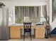 Bright home office nook features a large window with forest views, built in cabinets and countertop space at 197 Sawmill Ln, Idaho Springs, CO 80452