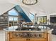 Beautiful kitchen showcasing mountain views with a professional range on a center island at 197 Sawmill Ln, Idaho Springs, CO 80452