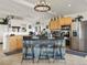 Modern kitchen featuring an island with seating, stainless steel appliances, and ample cabinet space at 197 Sawmill Ln, Idaho Springs, CO 80452