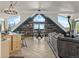 Open-concept living and dining area with vaulted ceilings, wood accents, and large windows with natural light and mountain views at 197 Sawmill Ln, Idaho Springs, CO 80452