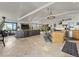 Spacious living room and kitchen area with modern appliances, tiled floors, and scenic outdoor views at 197 Sawmill Ln, Idaho Springs, CO 80452