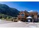 Exterior view of a charming wooden brewery nestled near the mountains, featuring outdoor seating and a welcoming facade at 2152 Bighorn Rd # 201, Georgetown, CO 80444