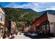 Charming street view with shops, boutiques, and restaurants with a mountain view in the background at 2152 Bighorn Rd # 201, Georgetown, CO 80444