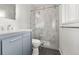 This bathroom has a toilet, sink and vanity, and a beautiful glass shower at 3565 S Holly St, Denver, CO 80237