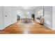 Bright dining room featuring hardwood floors and a large window for natural light at 3565 S Holly St, Denver, CO 80237