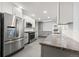 Modern kitchen featuring stainless steel appliances and granite countertops at 3565 S Holly St, Denver, CO 80237