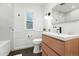 Modern bathroom features a stylish vanity, large mirror, and sleek fixtures at 1731 Locust St, Denver, CO 80220