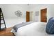 Cozy bedroom with hardwood floors, modern decor, and lots of natural light at 1731 Locust St, Denver, CO 80220